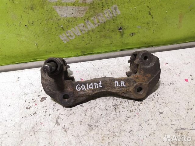 Скоба суппорта переднего Митсубиси Галант 6 Е30